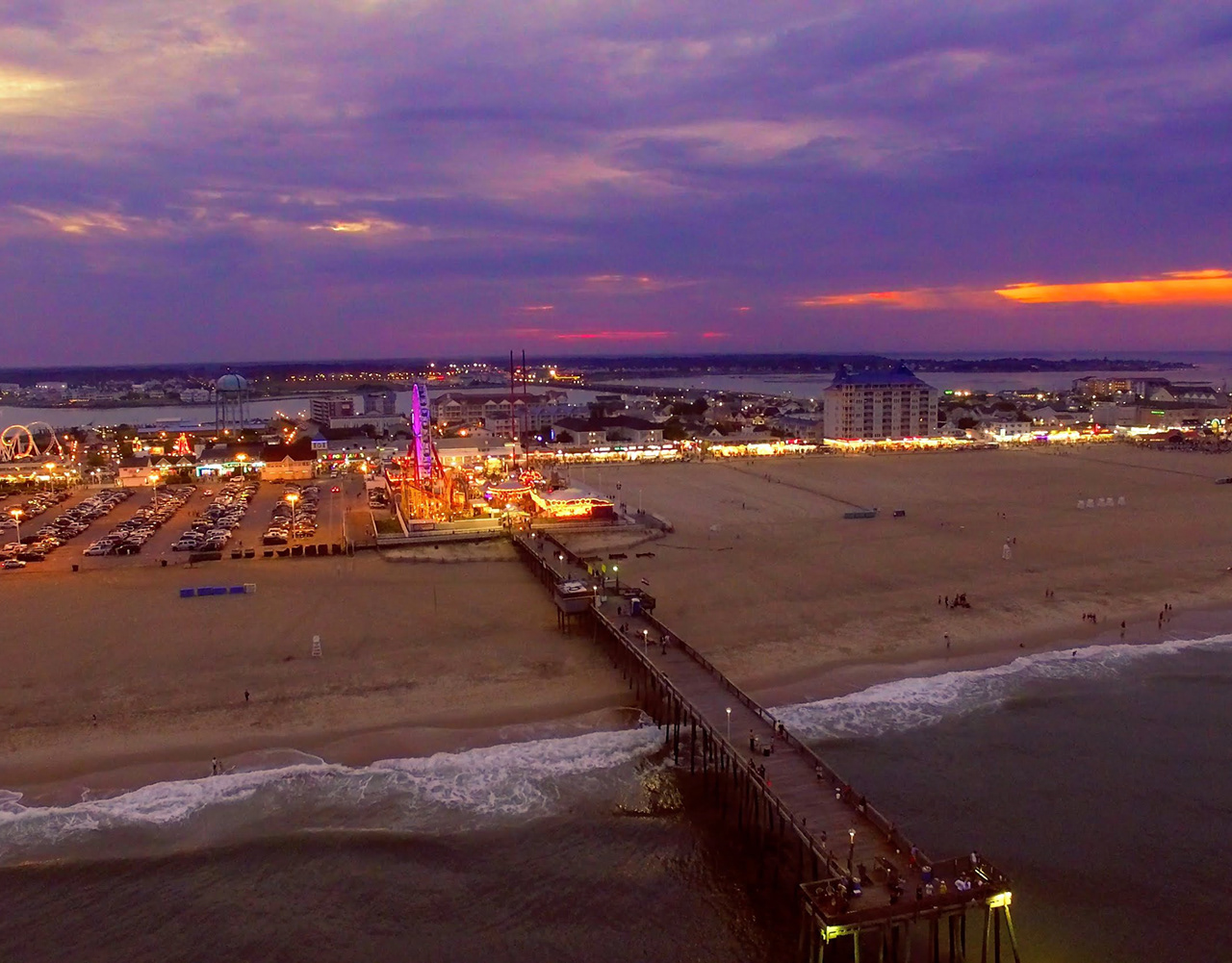 Jolly Roger amusement pier on the Ocean City coastline at dusk