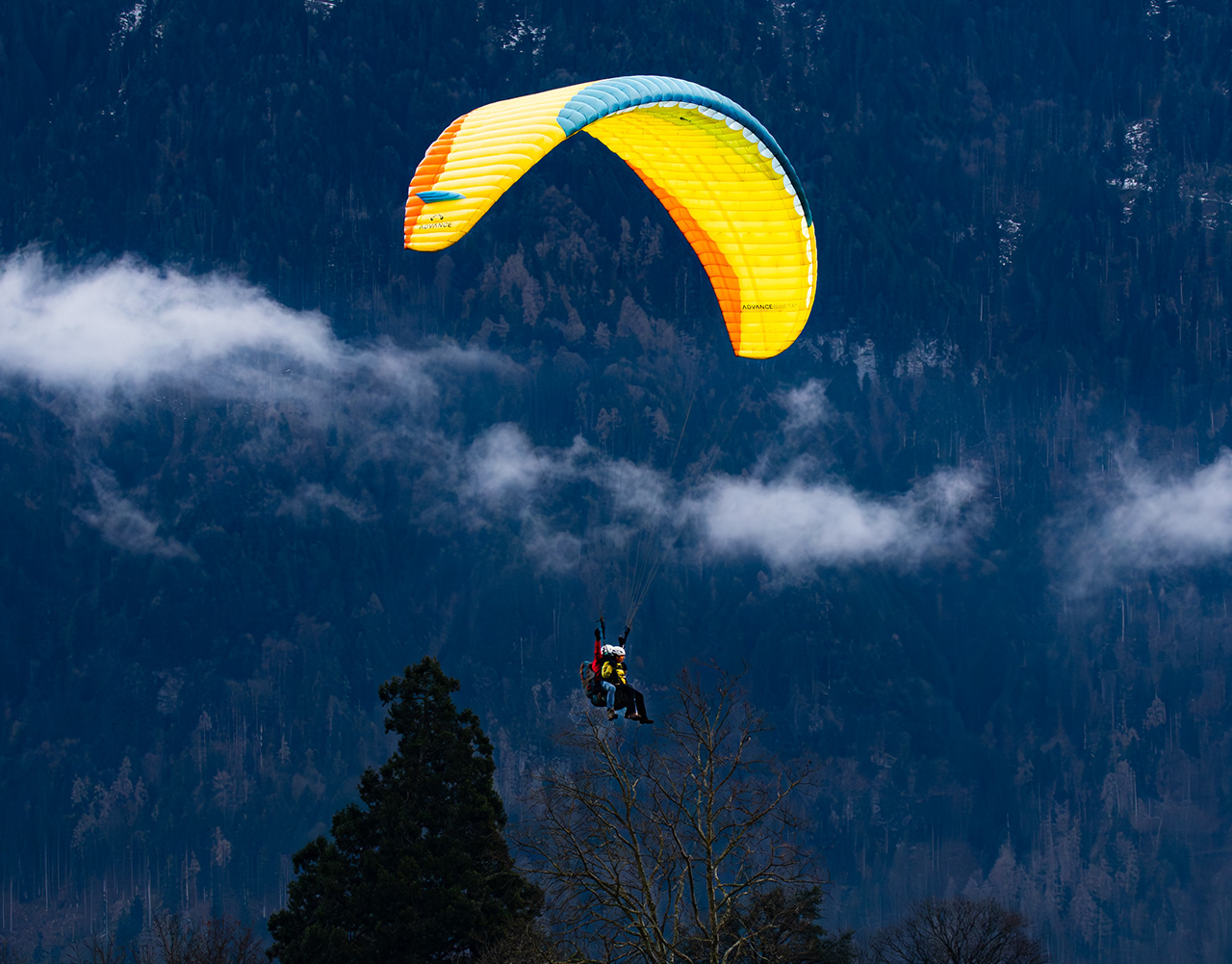 Paragliding above the mountains of Switzerland